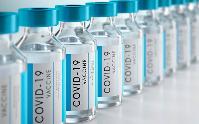 Bottles of COVID-19 vaccine lined up