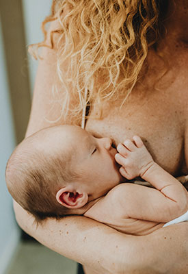 Closeup of a breastfeeding baby